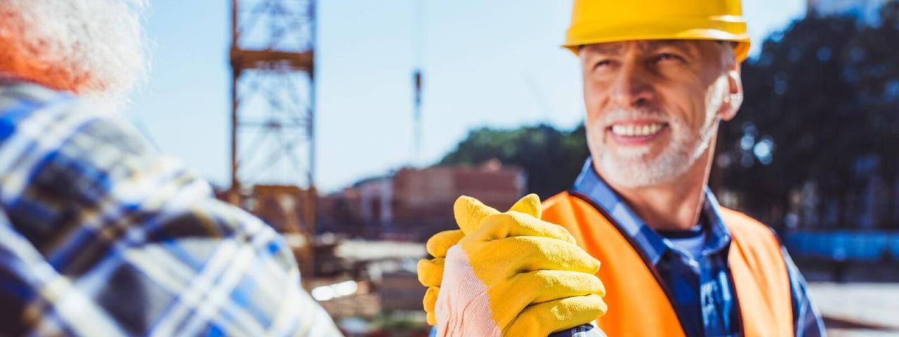 Health and safety officers holding hands.